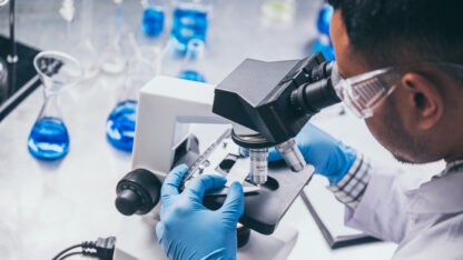 Health care researchers working in life science laboratory